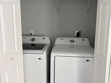 Laundry closet with a washer and dryer